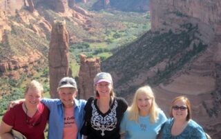 Women hiking the red buttes and desert landscapes of the west with Canyon Calling small group adventures
