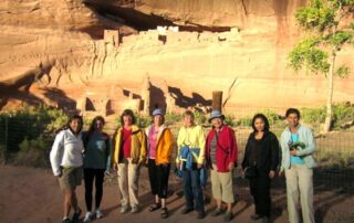 Women exploring desert ruins with Canyon Calling