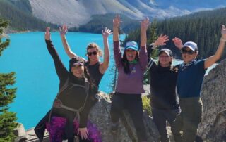 Women hikers celebrating a long day of trekking in the Canadian Rockies