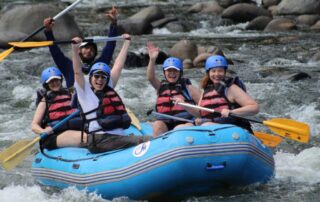 Women having the time of their lives rafting the turbulent waters of Costa Rica with Canyon Calling
