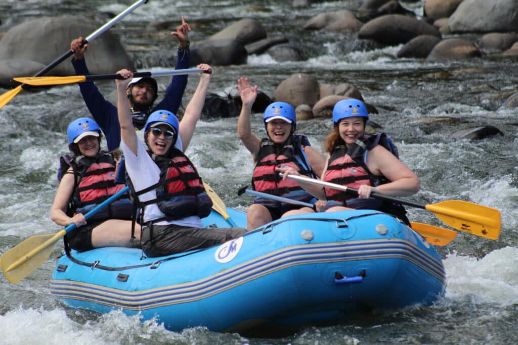 Women having the time of their lives rafting the turbulent waters of Costa Rica with Canyon Calling