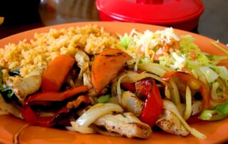 Chicken Fajita dinner on plate at a Mexican restaurant in the afternoon sunlight - Arizona adventures for women