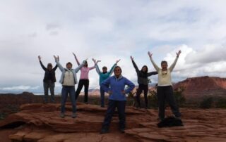 Women celebrating a long day of hiking in Capitol Reef National Park - Canyon Calling Adventure Tours