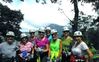 Women ziplining together in small groups in Costa Rica with Canyon Calling Adventures