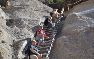 Women scaling the desert mountains of NM with Canyon Calling Adventures