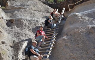 Women scaling the desert mountains of NM with Canyon Calling Adventures