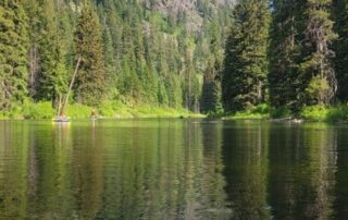 View of river and mountains in Idaho from a kayak