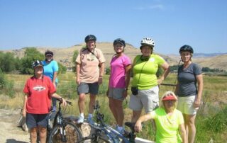 Women cycling through Idaho with Canyon Calling small group tours