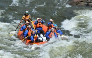 Women river rafting in small groups in Idaho with Canyon Calling
