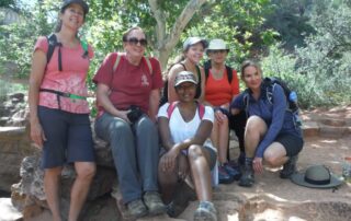 Women having a great time hiking together in Sedona, AZ with Canyon Calling Adventures