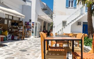 Women's Tours to the Greek Islands - Village of Tinos with Cycladic houses, cafes and shops on Tinos Island, Greece.