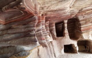 Multi-colored rock formations in Petra, Jordan: explore the red and pink caves with fellow women travelers