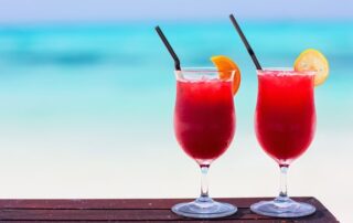 Two tropical cocktails served at beautiful beach