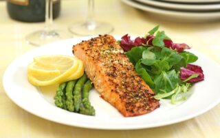 Baked salmon with green salad and fresh asparagus