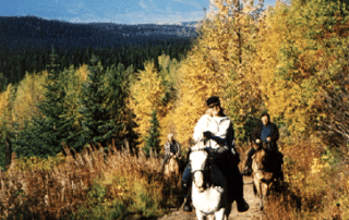 Women horseback riding in Moricetown Canyon with Canyon Calling