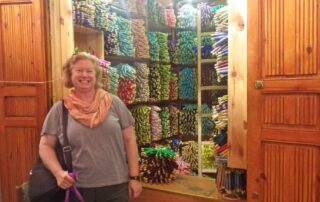 Woman shopping for thread in a souk in Morocco