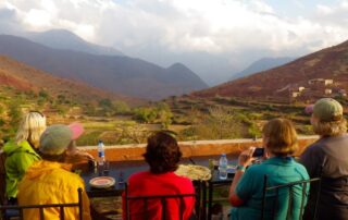 Women gazing out at the rolling hills and misty mountains in Morocco