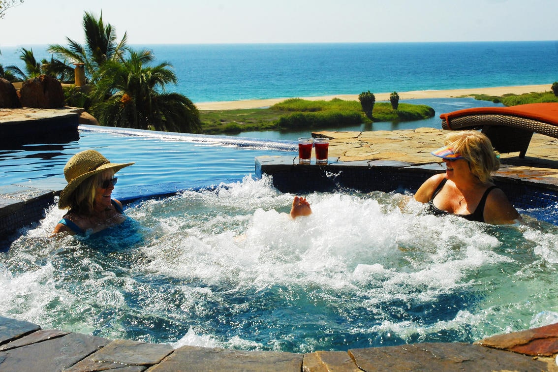 Women soaking in a hot tub in Baja -Canyon Calling Adventure Tours to Mexico