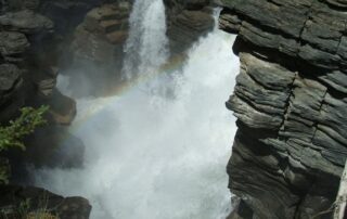 Beautiful waterfall between dark rock formations in Canada