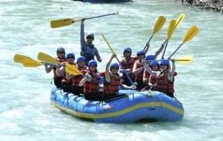 Women having a great time white water rafting in small groups with Canyon Calling