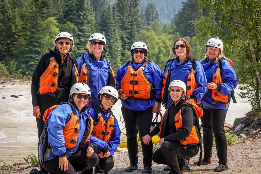 Go white water rafting with fellow women travelers on gal's active trips to the Canadian Rockies
