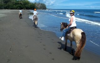 Women horseback riding along the beach - Canyon Calling Adventure Tours to Costa Rica