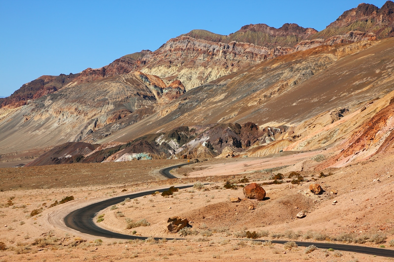 Excellent road winding through Death Valley in the USA. The desert and mountains of California.