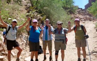 Women hiking together in small groups on a desert getaway to Phoenix with Canyon Calling Adventure Tours