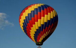 Vivid primary colored hot air balloon - womens travel adventure tours to Albuquerque