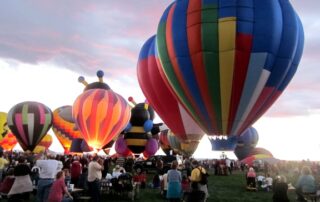 Close up several colorful hot air balloons at the Albuquerque International Balloon Fiesta with Canyon Calling