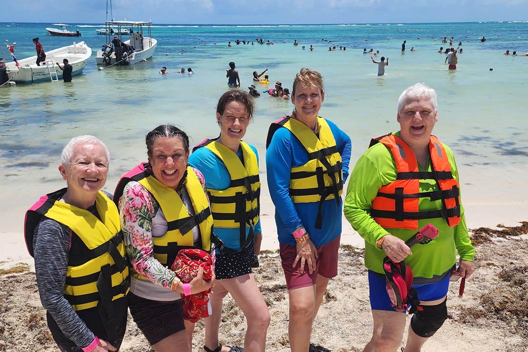 Beautiful Baja Adventure with Canyon Calling. Pictured: Women at the beach getting ready to kayak and snorkel.