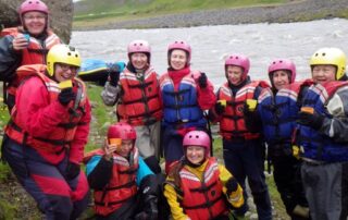 Women getting ready to kayak in Iceland - Getaways with Canyon Calling Adventures