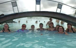 Women soaking in natural hot pools of Iceland
