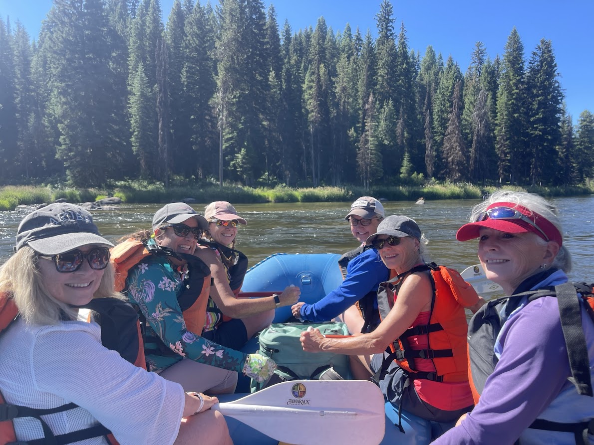 Women having fun rafting the turbulent waters of Idaho with Canyon Calling