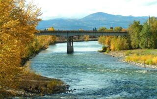 View of a bridge amidst the changing leaves of autumn - Idaho trips for women