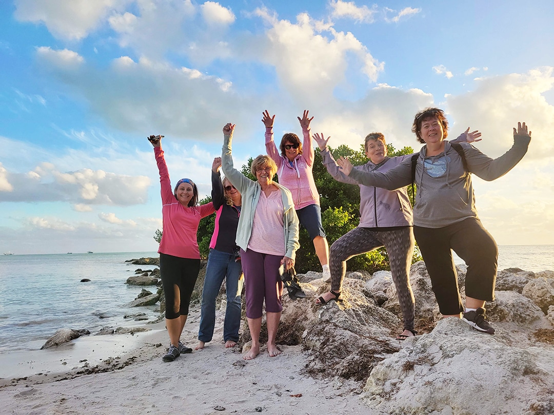 Women having a blast walking the beaches of Key West