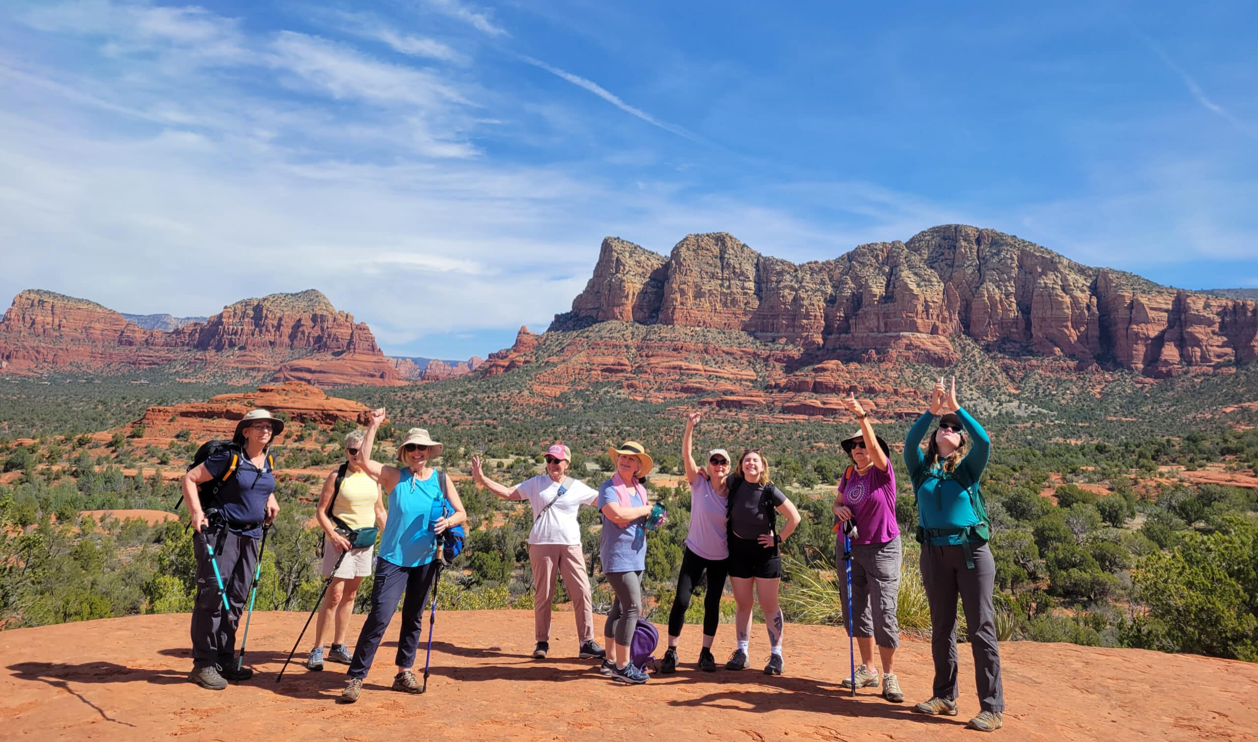 Women celebrating a long day of hiking Ball Rock - Canyon Calling Travel Adventures