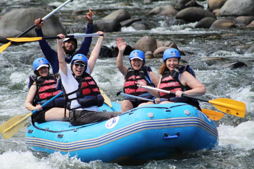 Women having the time of their lives rafting the turbulent waters of Costa Rica with Canyon Calling Adventures