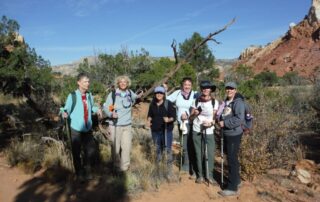 Women hiking together in small groups through Ghost Ranch, Northern New Mexico