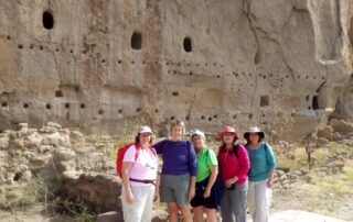 Small group of women exploring the Bandelier National Monument, NM with Canyon Calling Adventures
