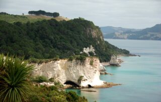 Scenic view of white cliffs and beautiful blue waters in New Zealand