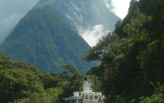 Sail on the historic steam ship Earnslaw across Lake Wakatipu, New Zealand with fellow women travelers