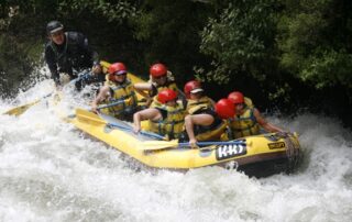 Women white water rafting on the Tongariro River, New Zealand