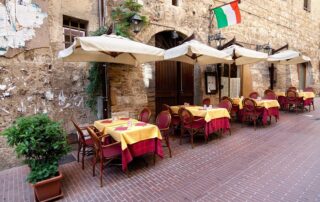 Lounge at outdoor cafes with fellow women travelers