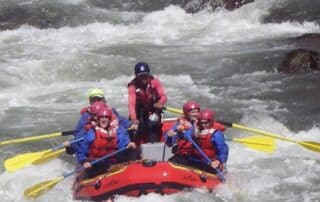 Women having a blast white water rafting in small groups with Canyon Calling Adventure Tours
