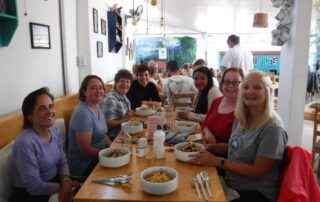 Women trying local cuisine in Peru, South America