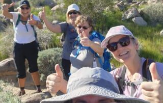 Small group of women travelers having a blast on a hike in Palm Springs with Canyon Calling