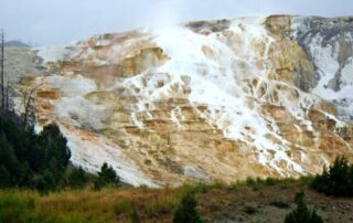 Visit the Mammoth Hot Springs on your next gal's trip with Canyon Calling Adventure tours for women only