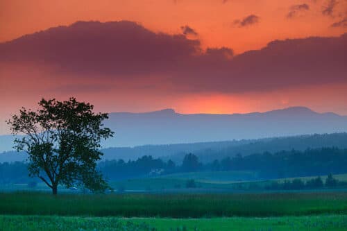 Colorful sunset and clouds over Mt. Mansfield in Stowe Vermont, USA